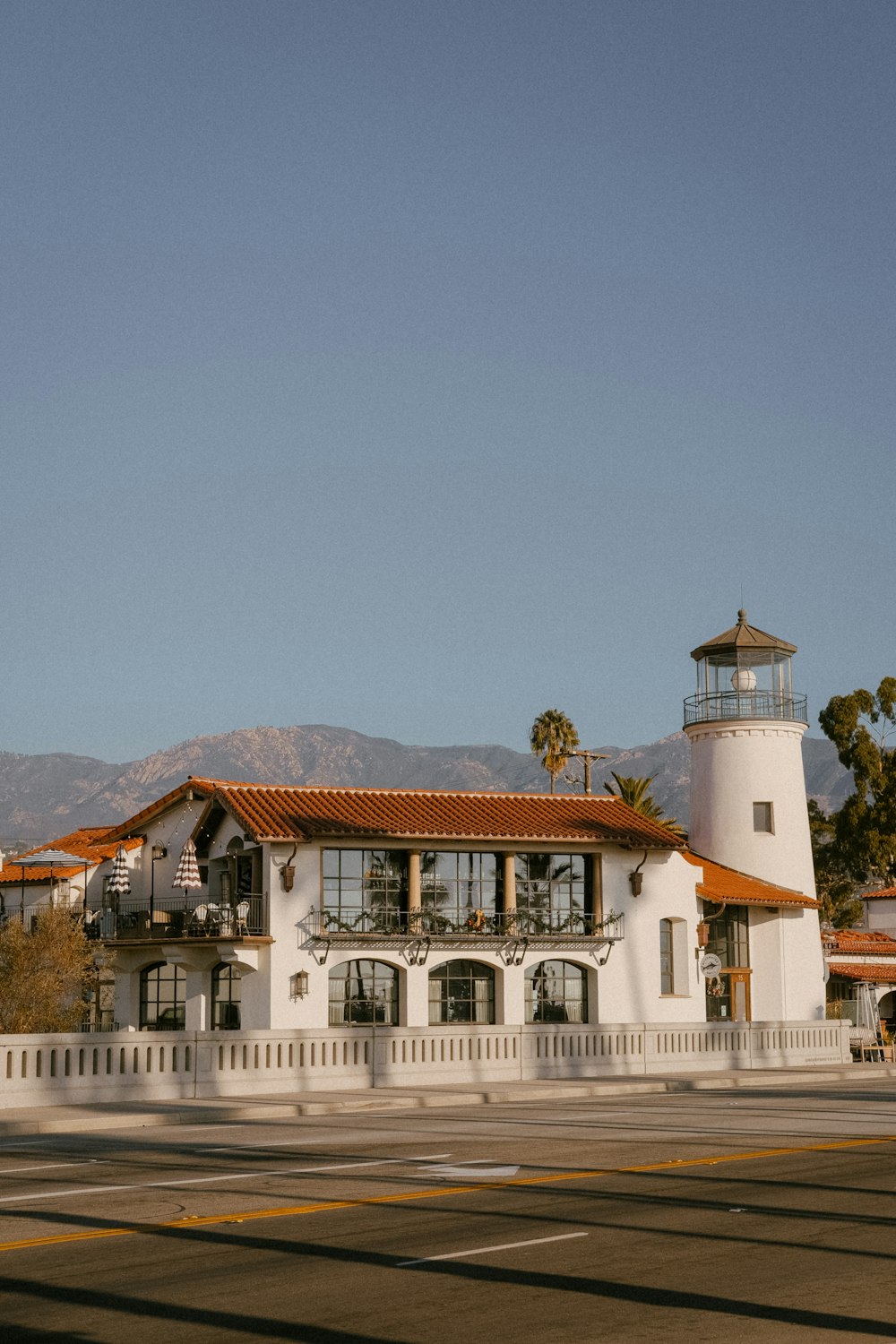 a large white building with a clock tower