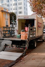a moving truck with boxes on the back of it