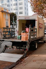 a moving truck with boxes on the back of it