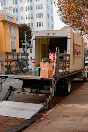a moving truck with boxes on the back of it