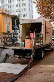 a moving truck with boxes on the back of it