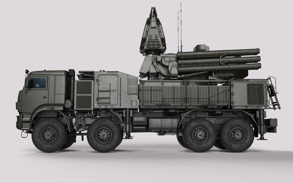 a military truck with a missile on top of it