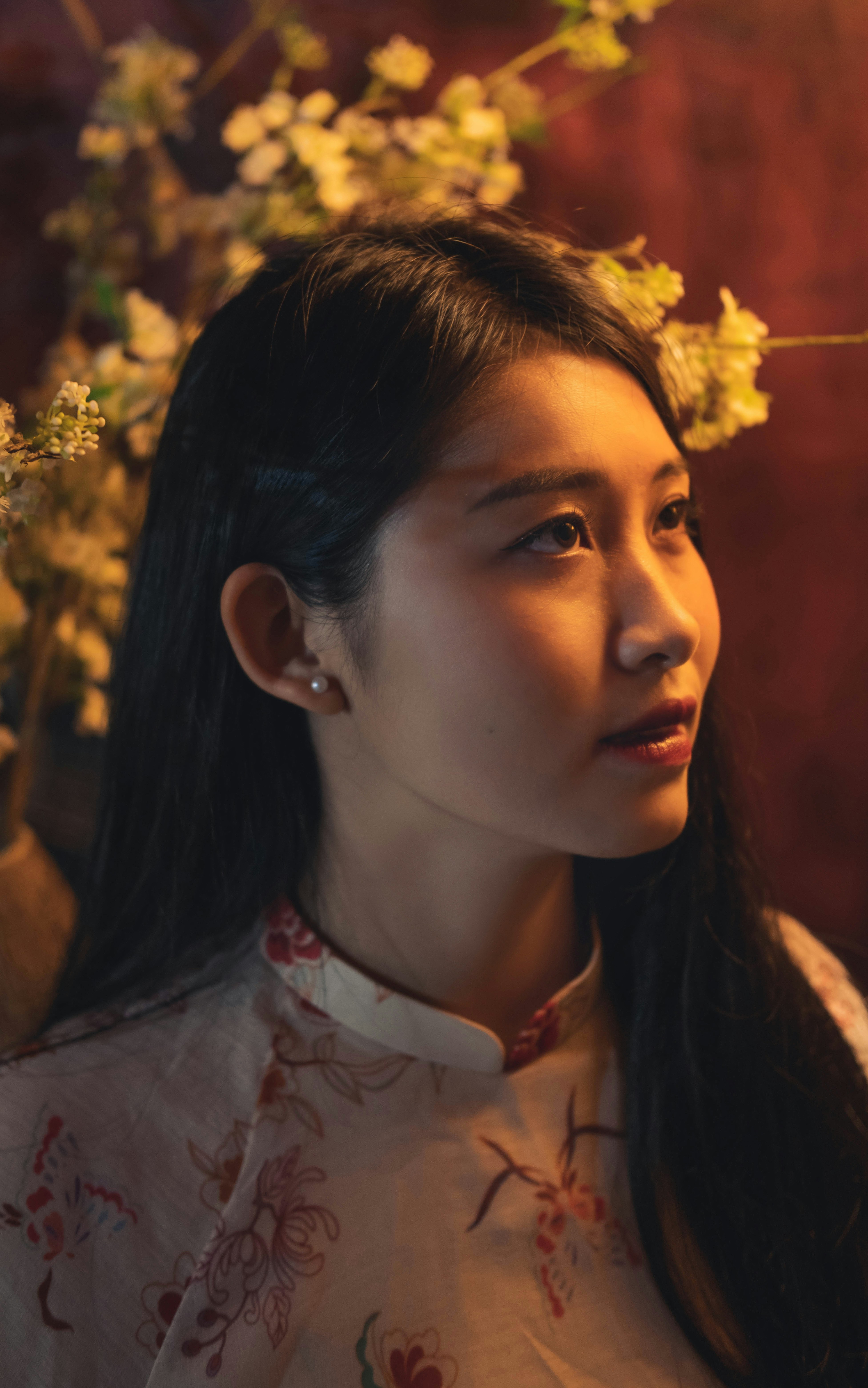 A woman with long hair and a flower in her hair photo – Free Head Image ...