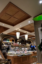 a restaurant with a lot of food on the counter