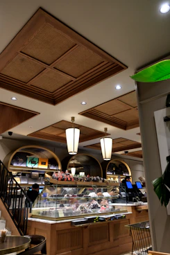 a restaurant with a lot of food on the counter