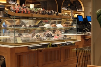 a bakery filled with lots of different types of cakes
