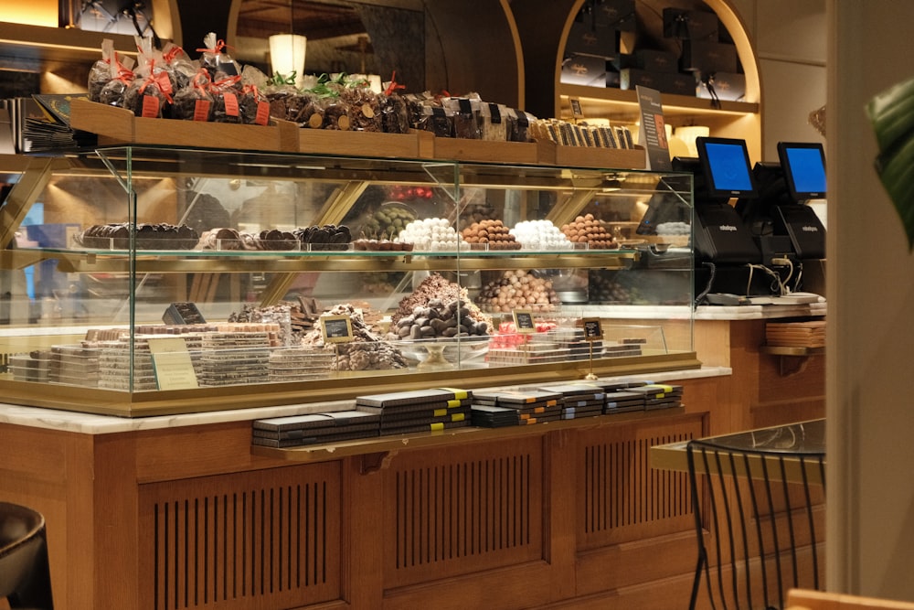 a bakery filled with lots of different types of cakes