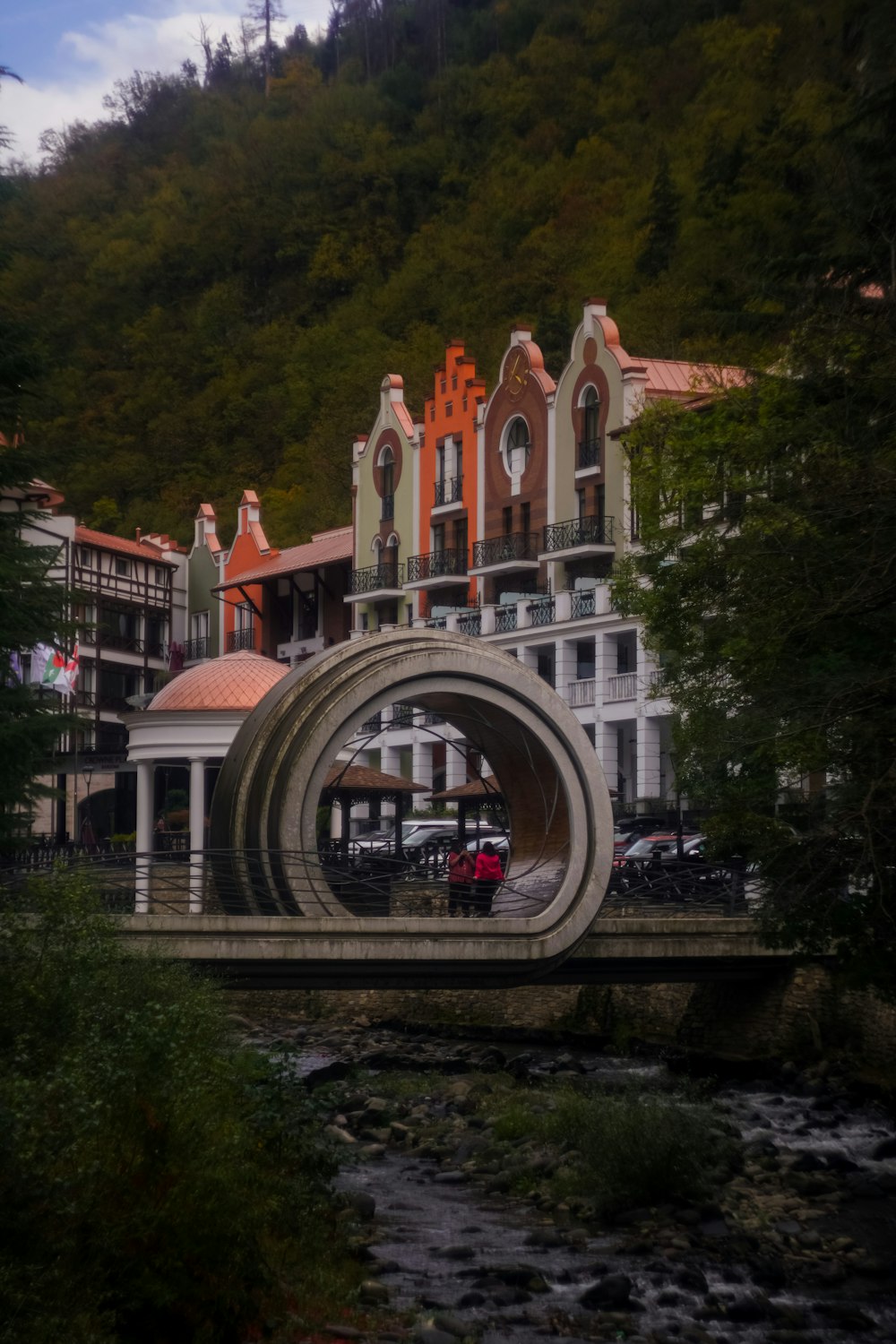 a bridge with a building in the background