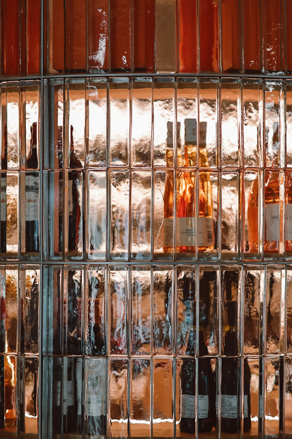 a bunch of bottles that are sitting on a shelf