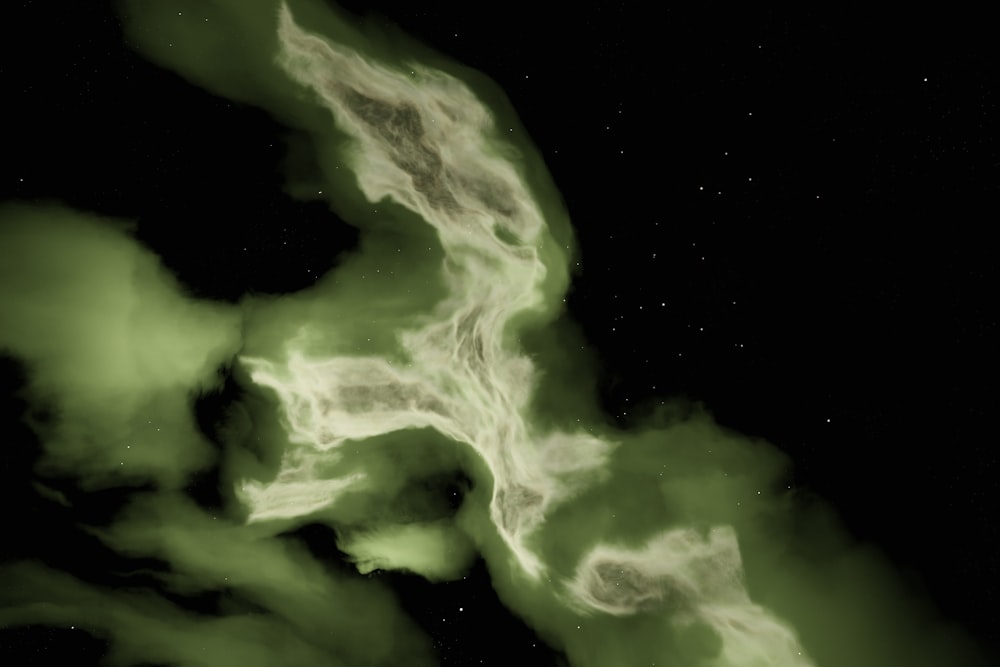 a black background with some green smoke coming out of it