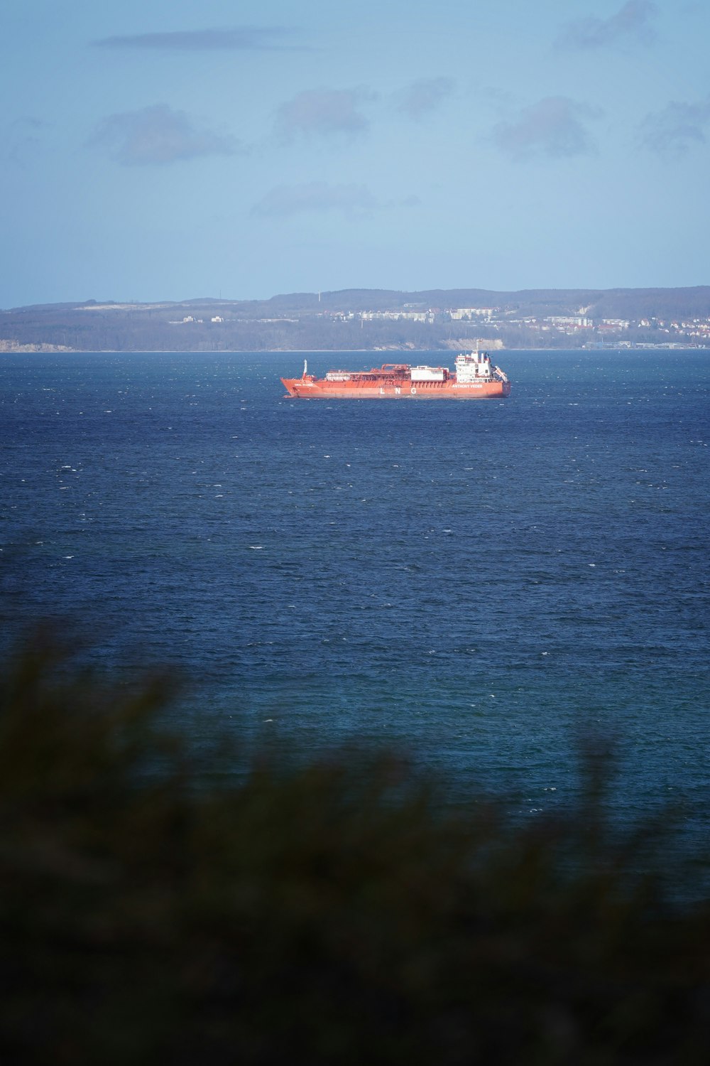 a large boat in the middle of a large body of water