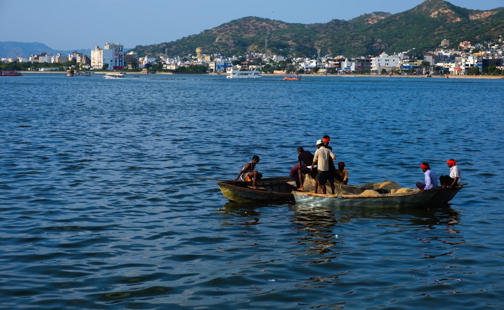 a group of people riding on the back of a boat