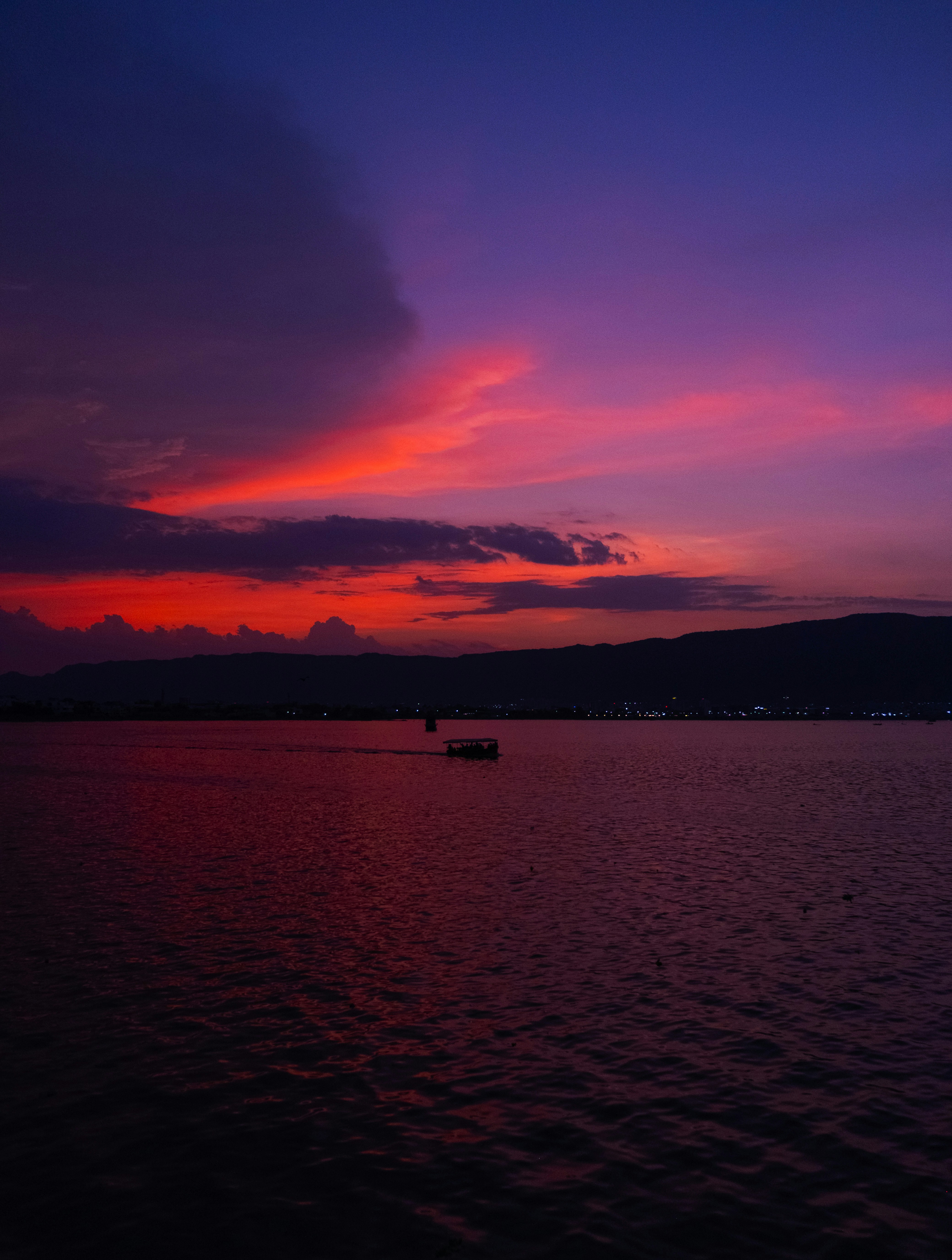 a boat floating on top of a large body of water