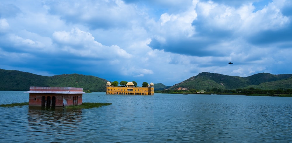 a large body of water with a building in the middle of it