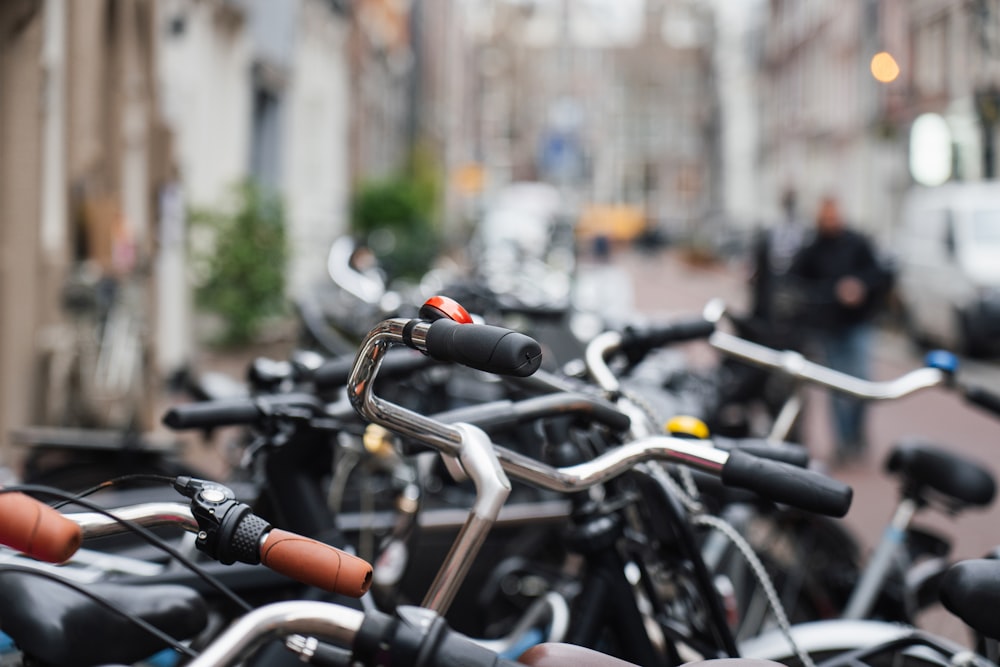 a row of bikes parked next to each other on a street