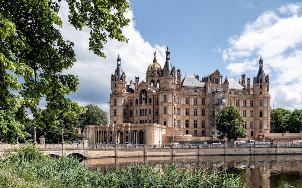 a large building sitting next to a body of water