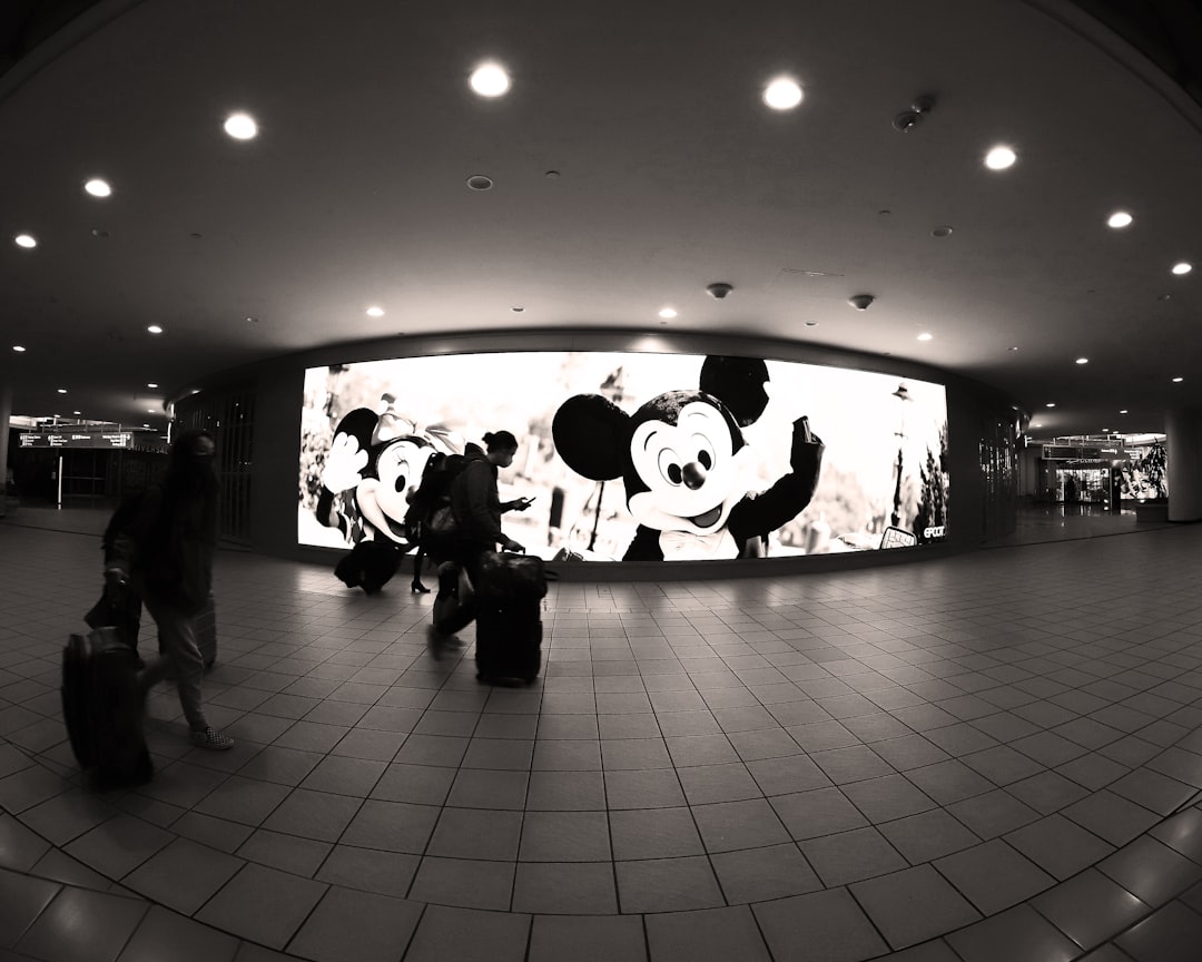 a black and white photo of people with luggage, Micky during Covid