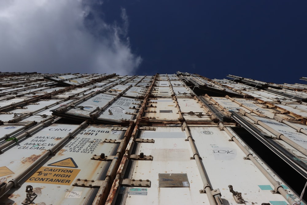 a very tall building with lots of metal containers stacked on top of each other