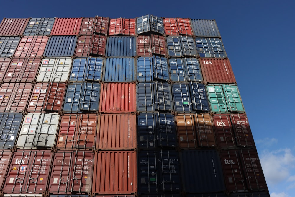 a large stack of cargo containers stacked on top of each other