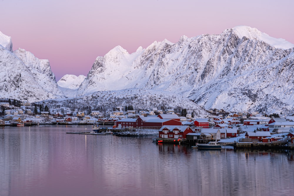 a group of snow covered mountains surrounding a small town