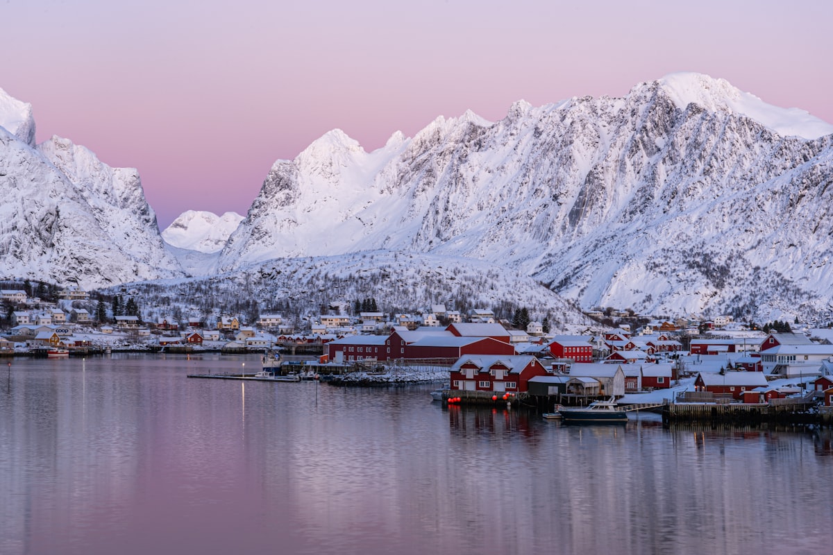 Svolvær Lofoten — harbour with fishing boats and Svolværgeita rock spire behind