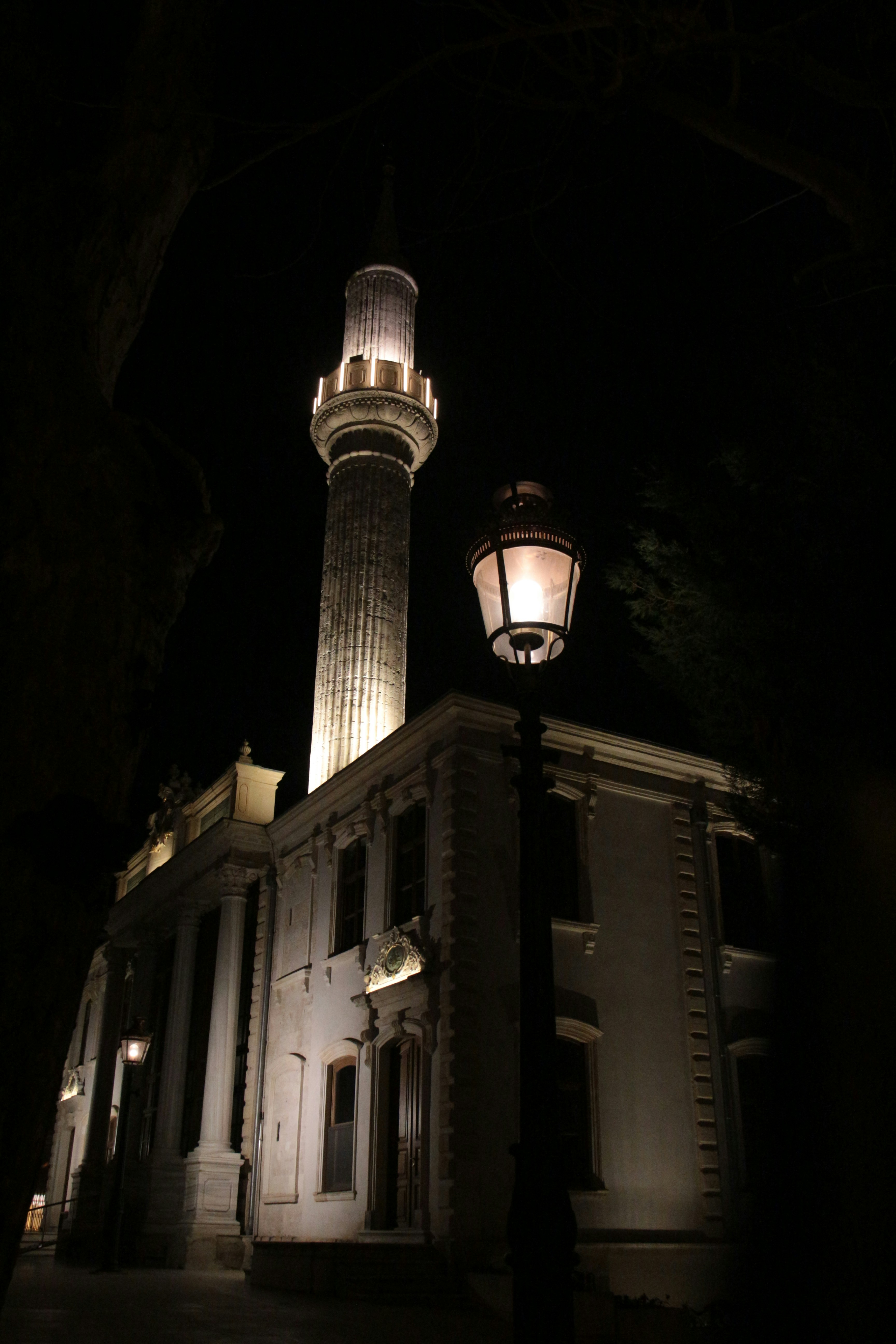 a tall building with a light on top of it