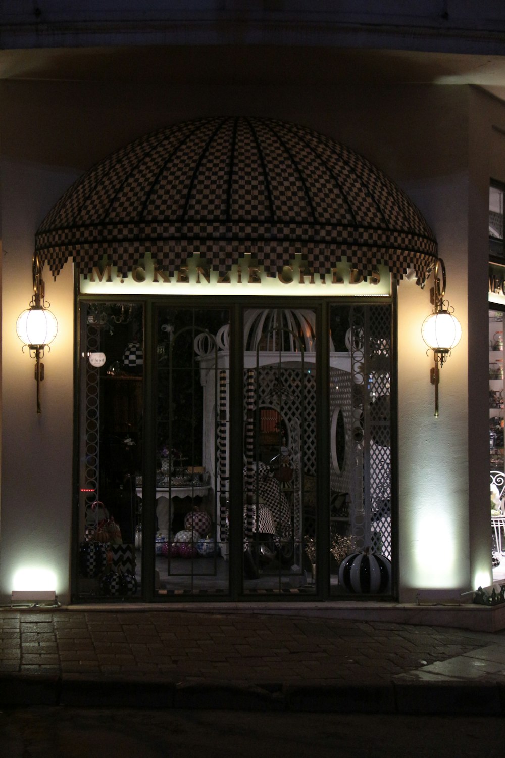 a store front with a lit up entrance