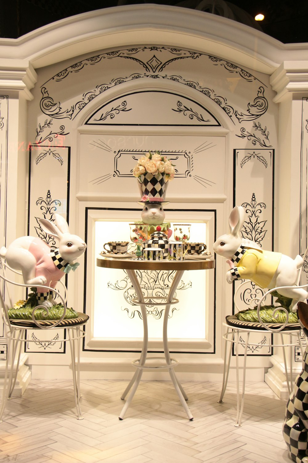 a room with a table and chairs decorated with easter decorations