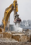 a construction site with an excavator in the foreground