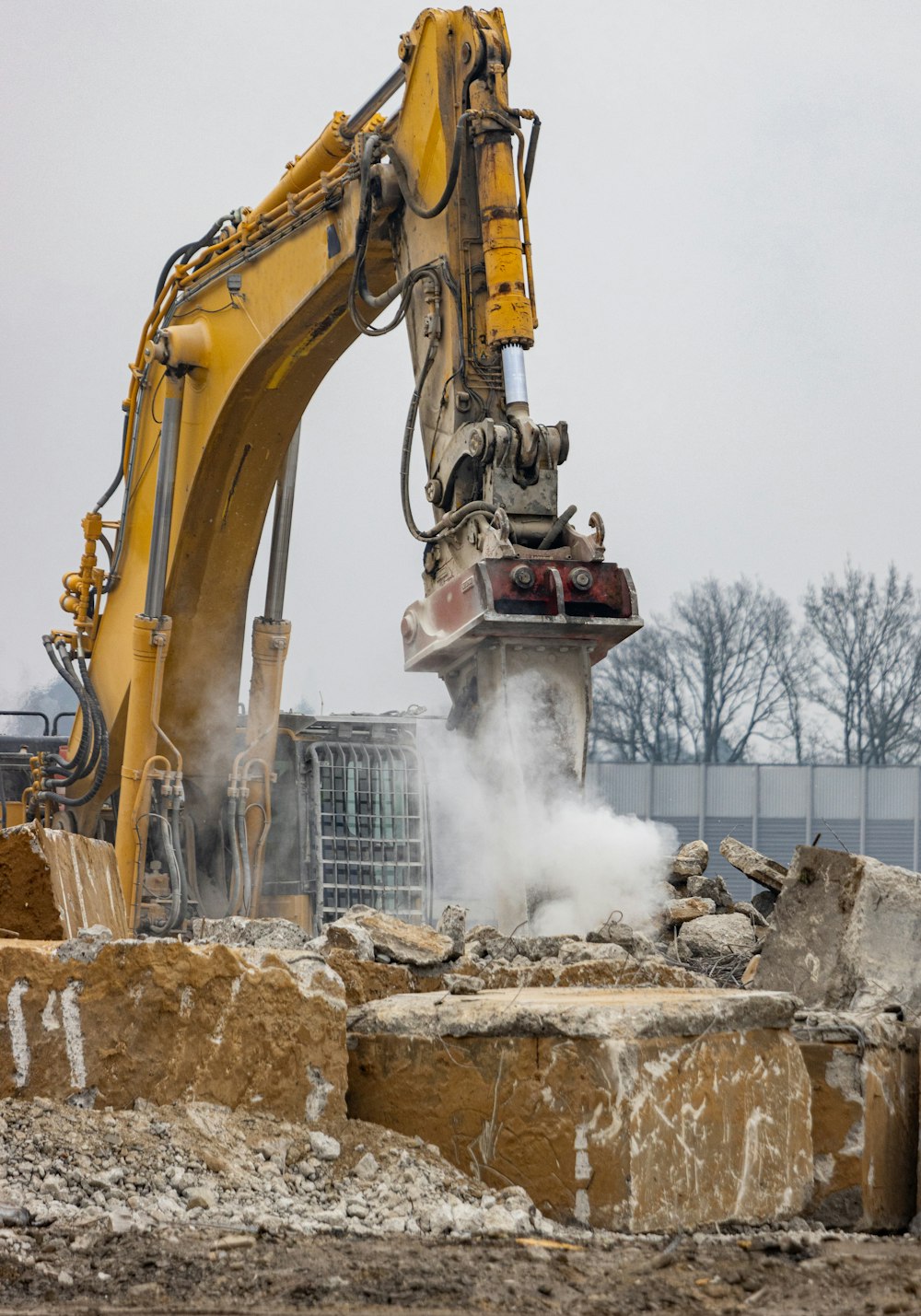 a construction site with an excavator in the foreground