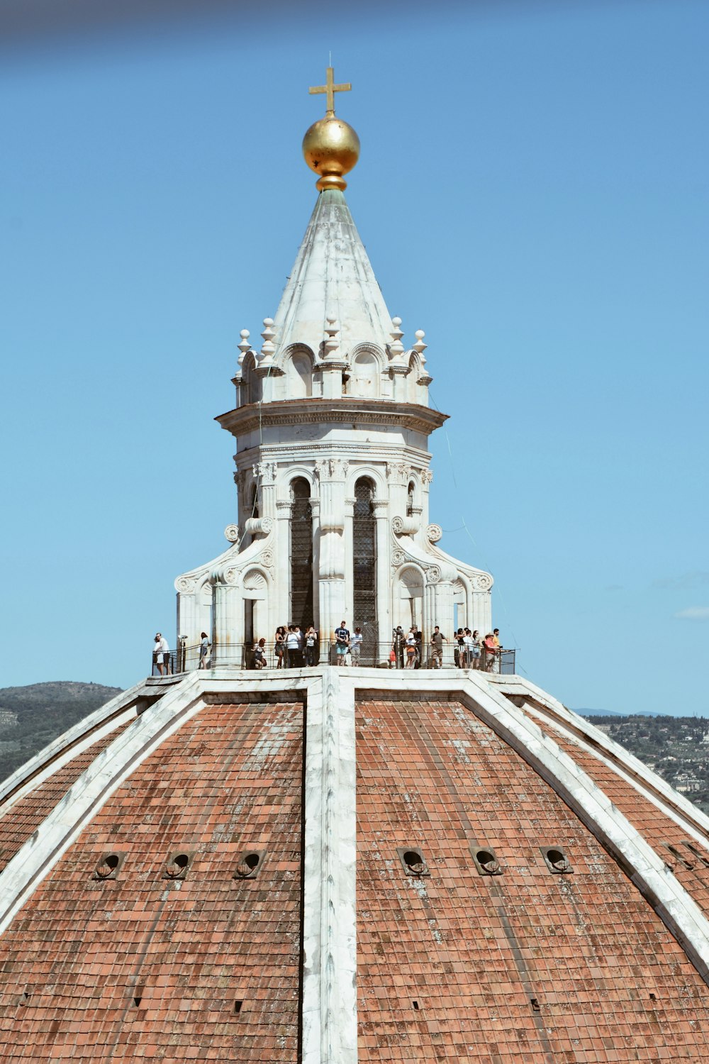 a very tall white building with a golden dome