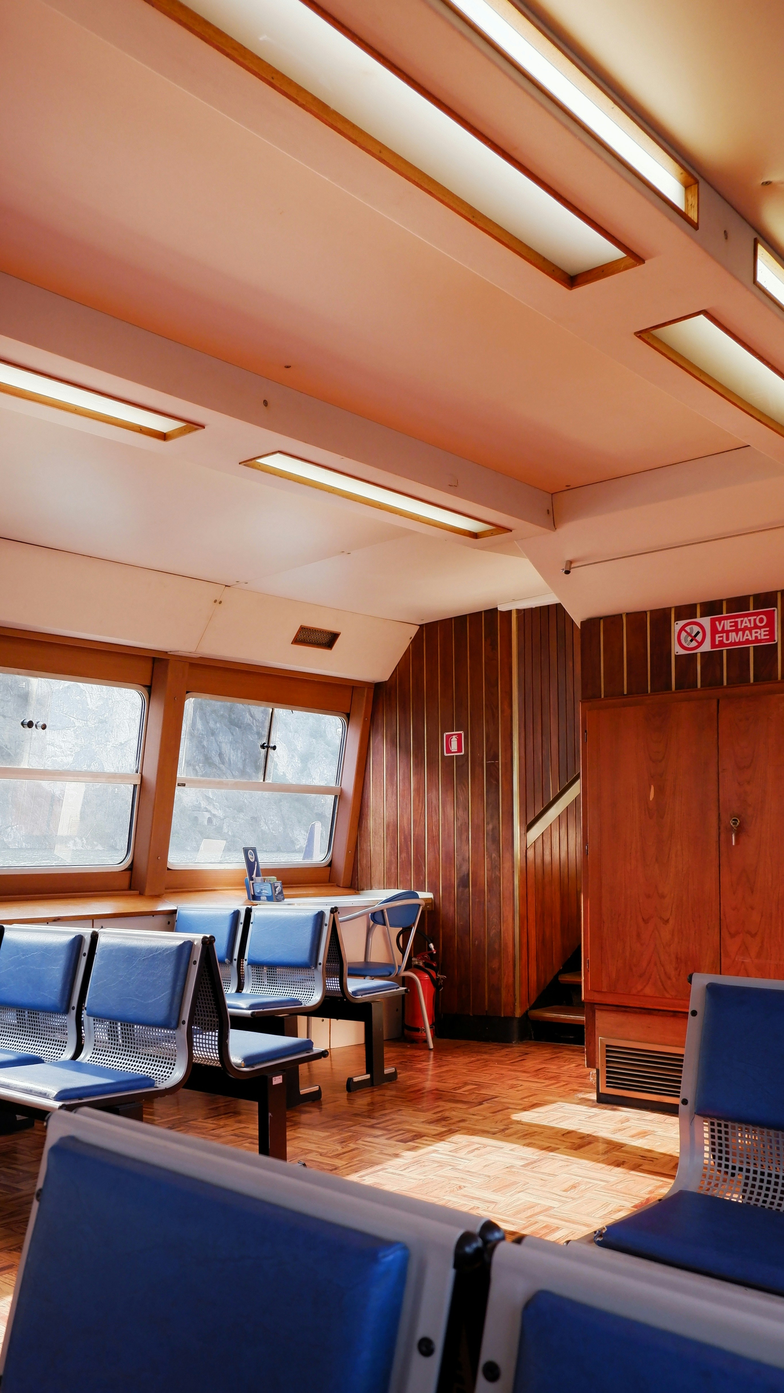 a room filled with lots of blue chairs