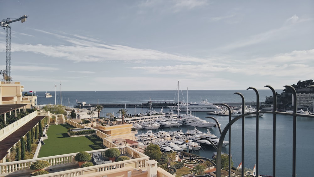 a marina filled with lots of boats on top of a body of water