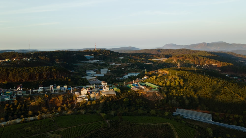 an aerial view of a town surrounded by mountains