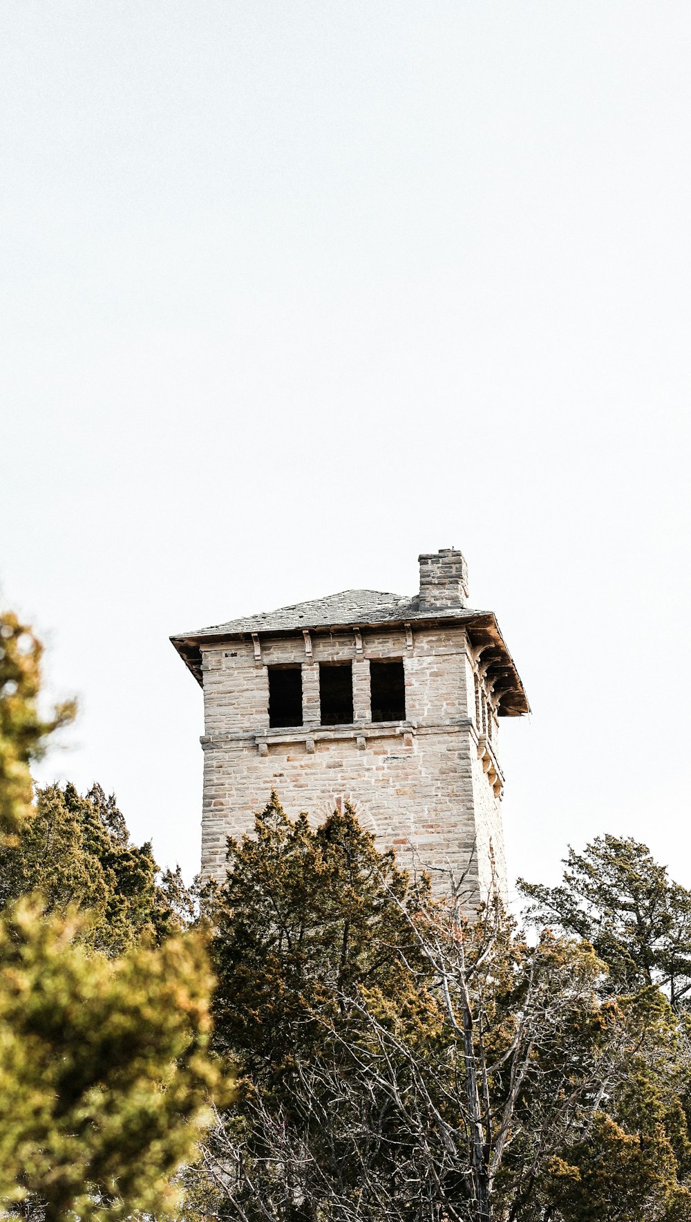 a tall tower with a clock on the top of it