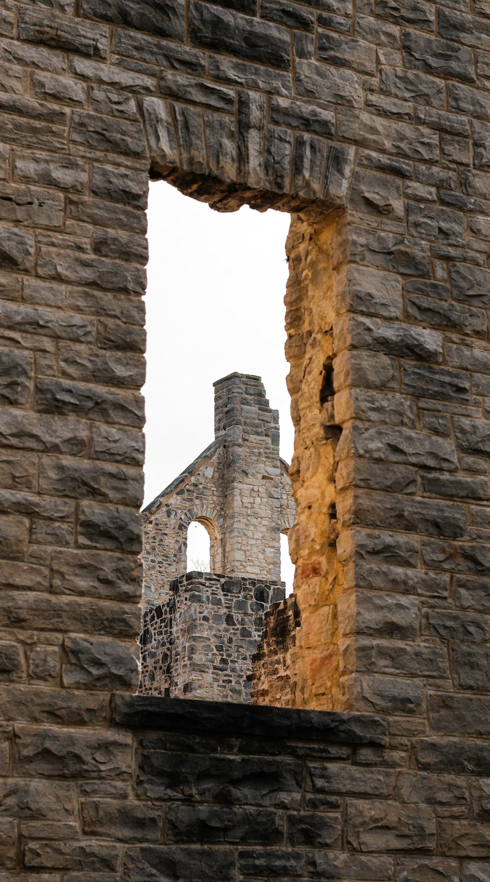a stone building with a window in it