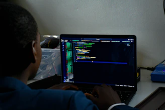 a student sitting in front of a laptop computer