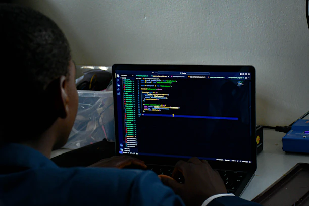 a student sitting in front of a laptop computer