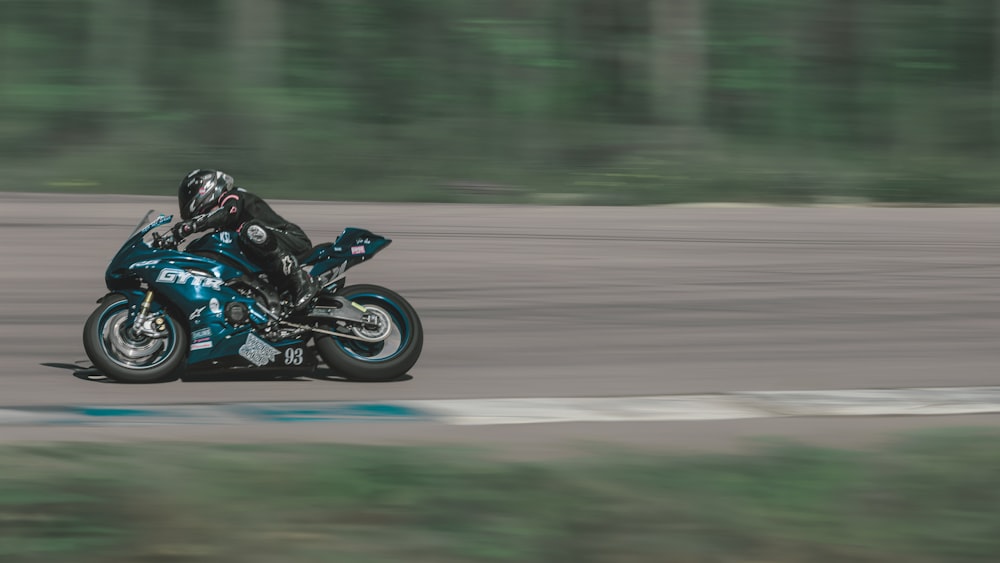 a person riding a motorcycle on a race track