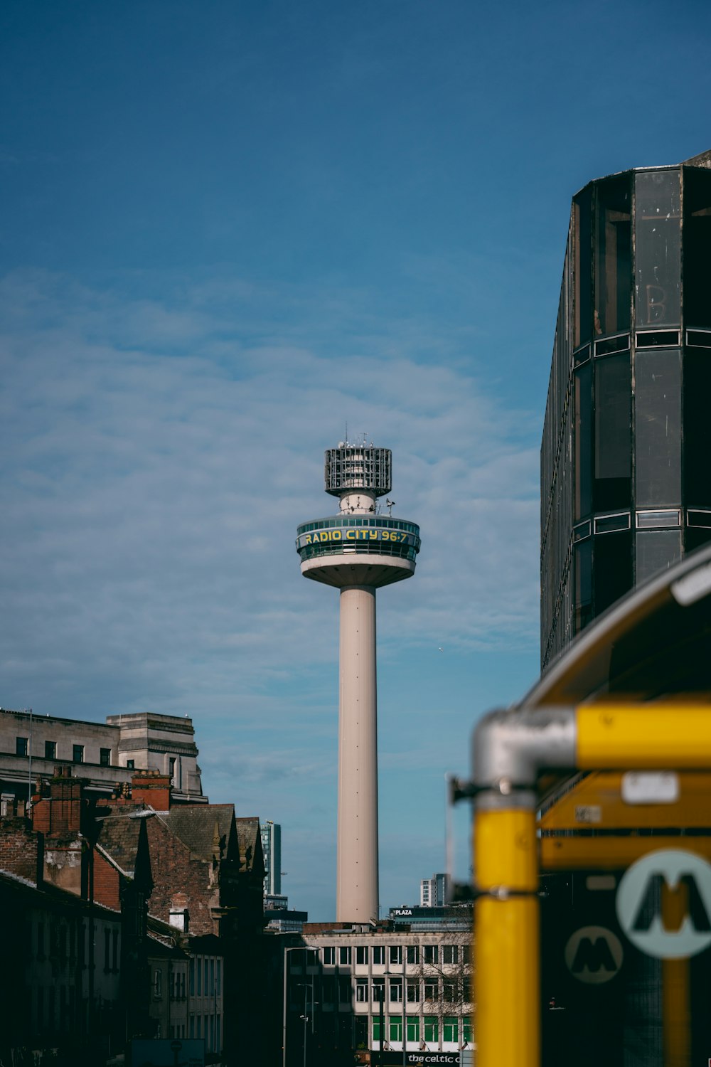 a tall tower with a clock on the top of it