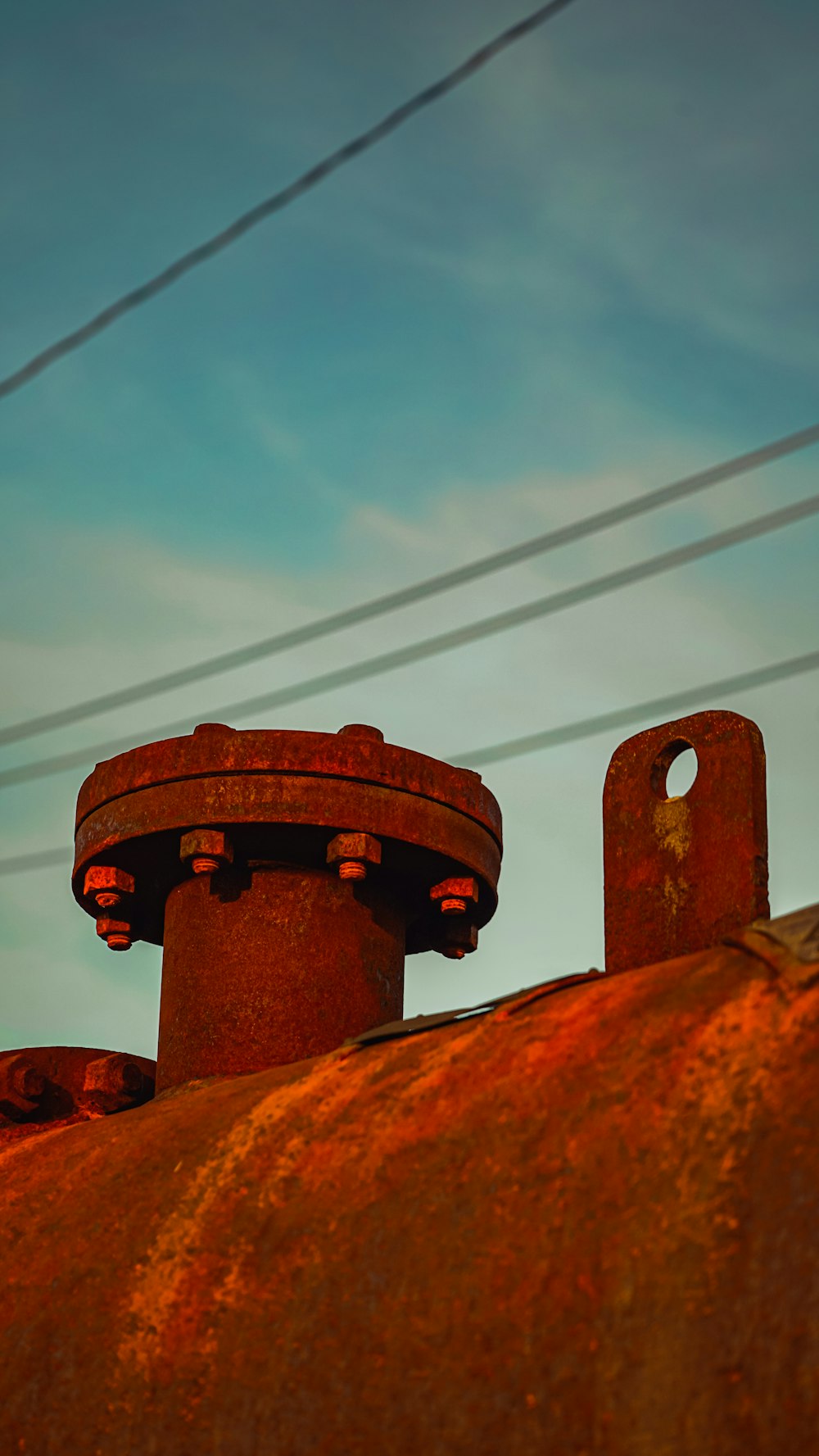 a rusted out building with power lines in the background