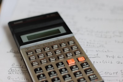 a calculator sitting on top of a piece of paper
