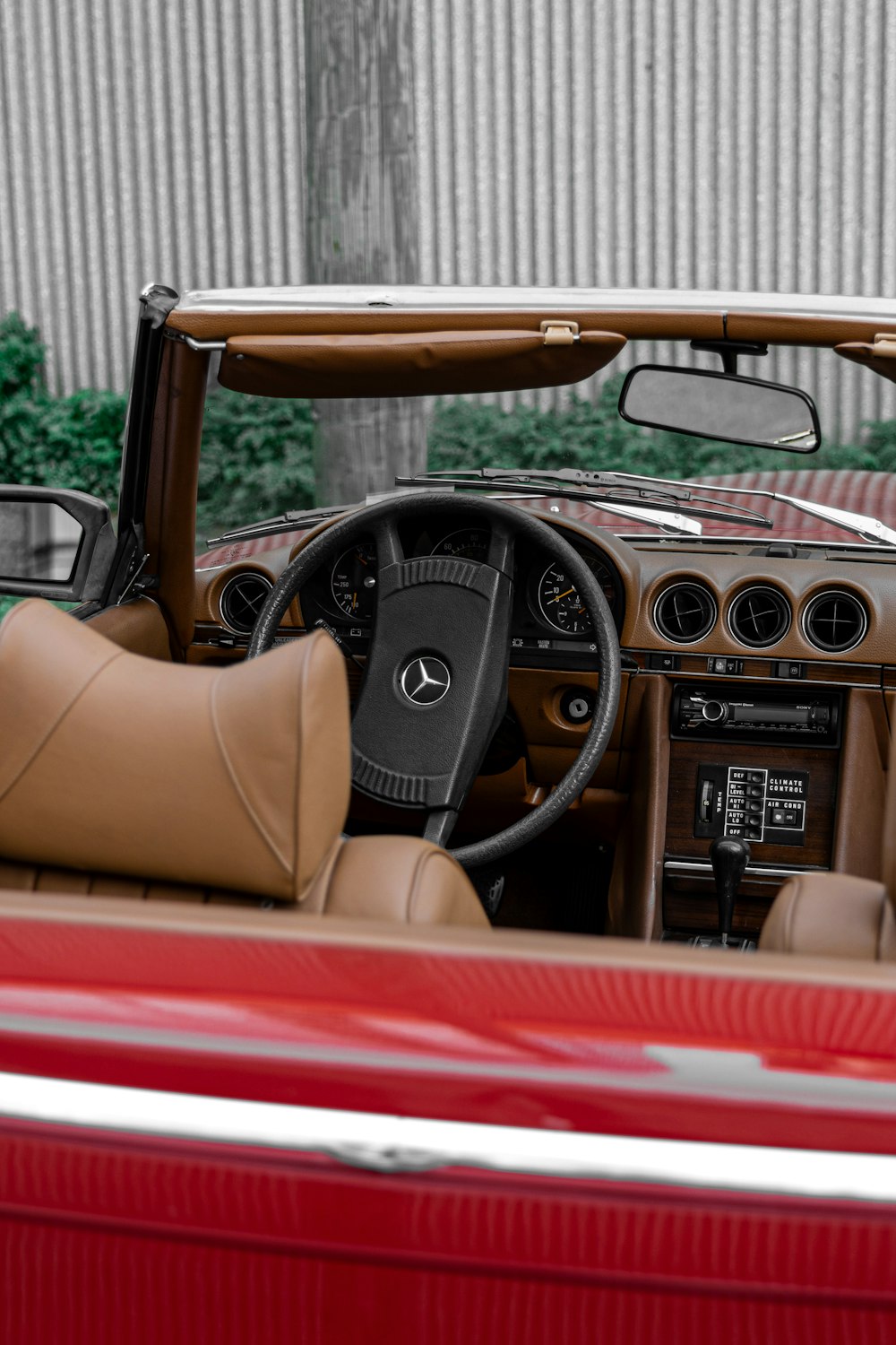 the interior of a red convertible car