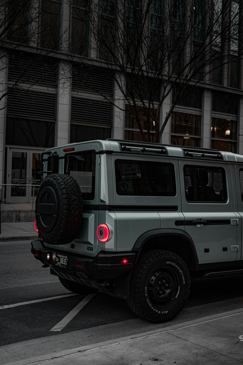 a jeep is parked on the side of the road