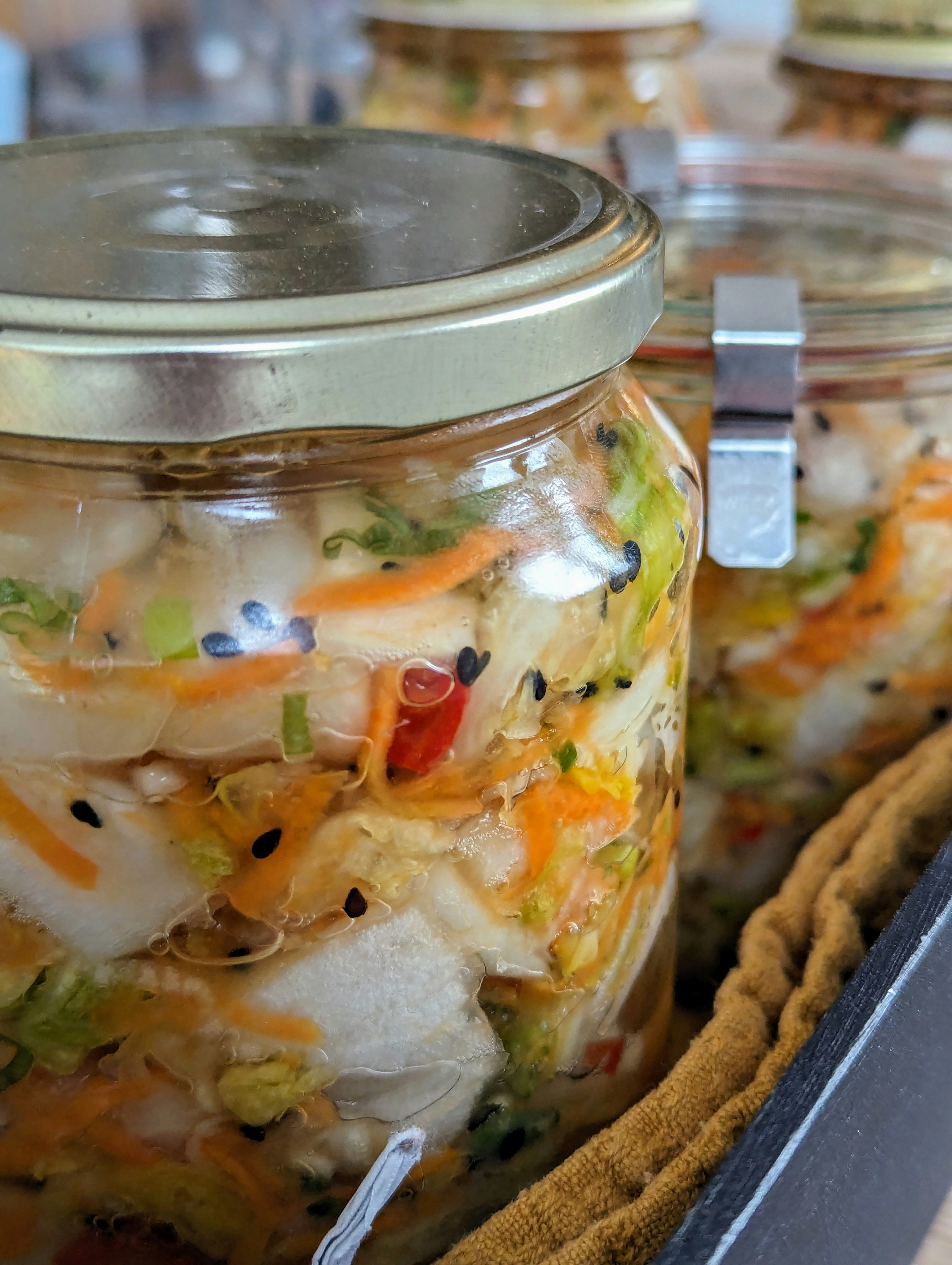 Ceramic jar of house-fermented napa cabbage kimchi