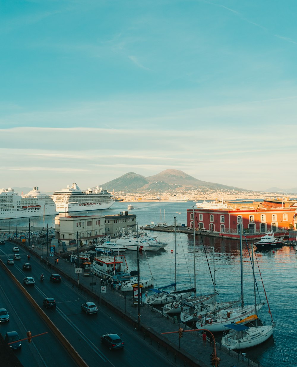 a cruise ship docked in a harbor next to a pier