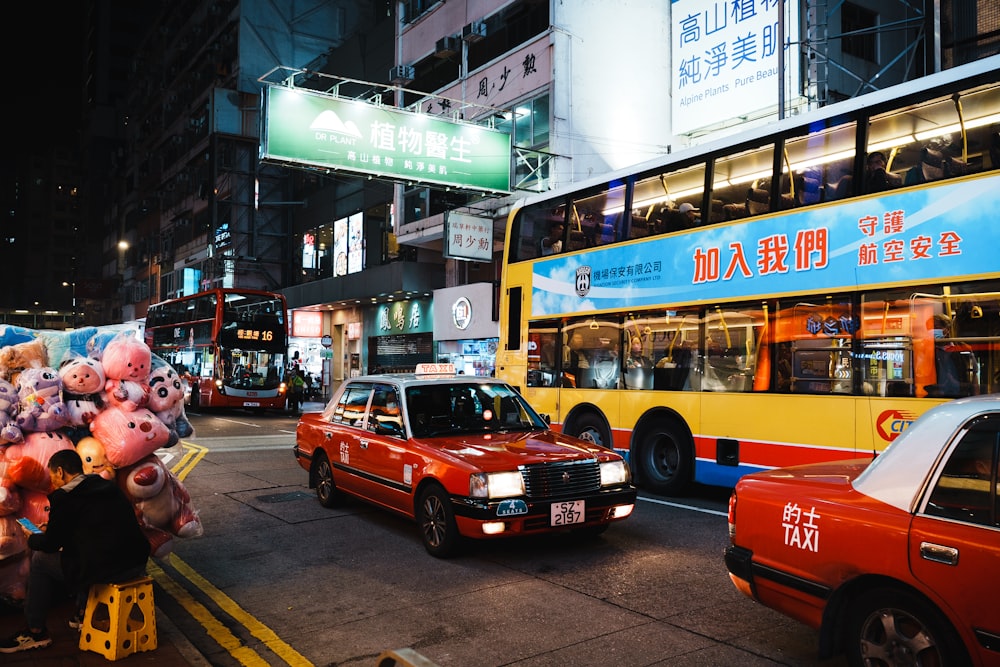 a double decker bus driving down a busy street