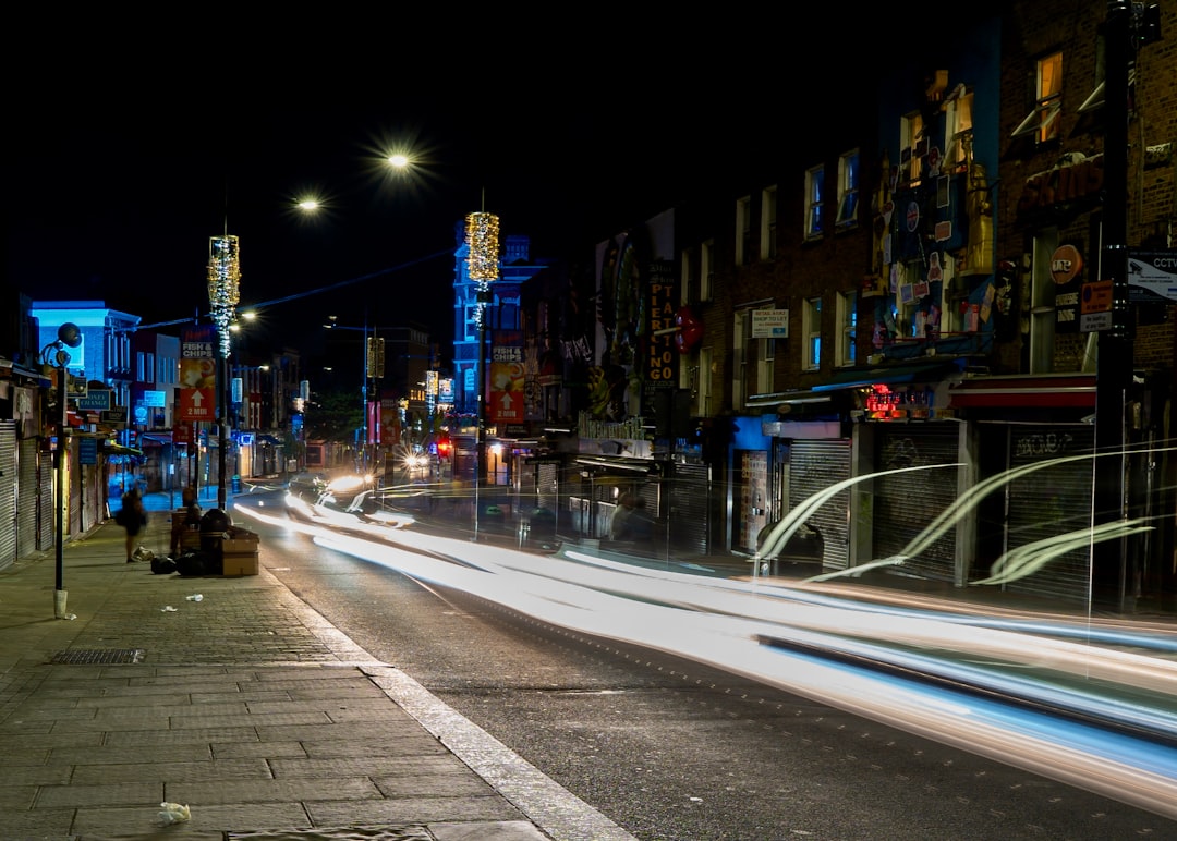 a blurry photo of a city street at night,