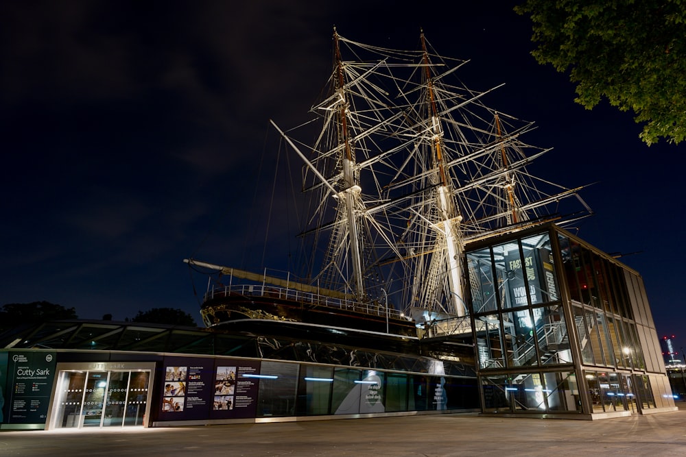 a tall ship sitting on top of a building