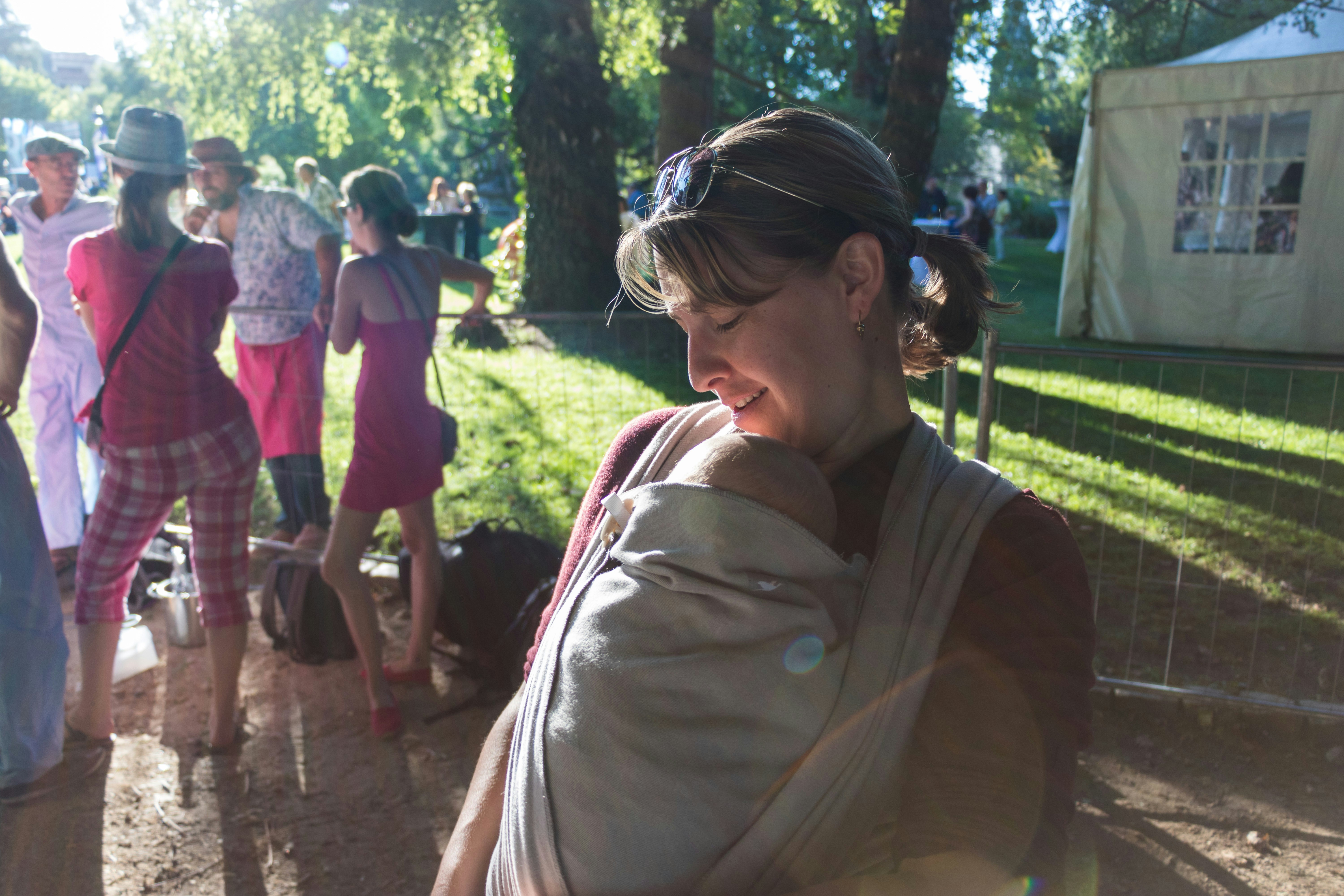 a group of people standing around each other